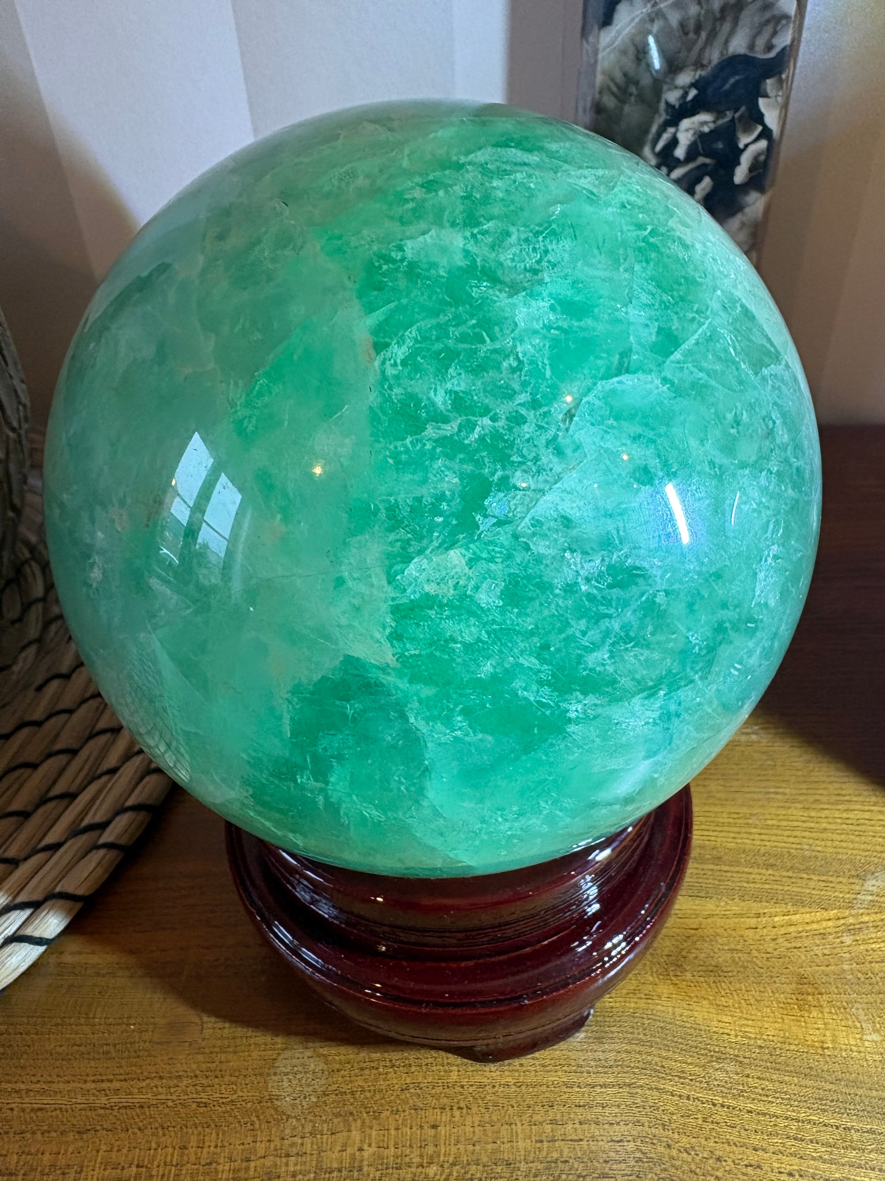 XXL Fluorite Sphere with spinning wooden stand
