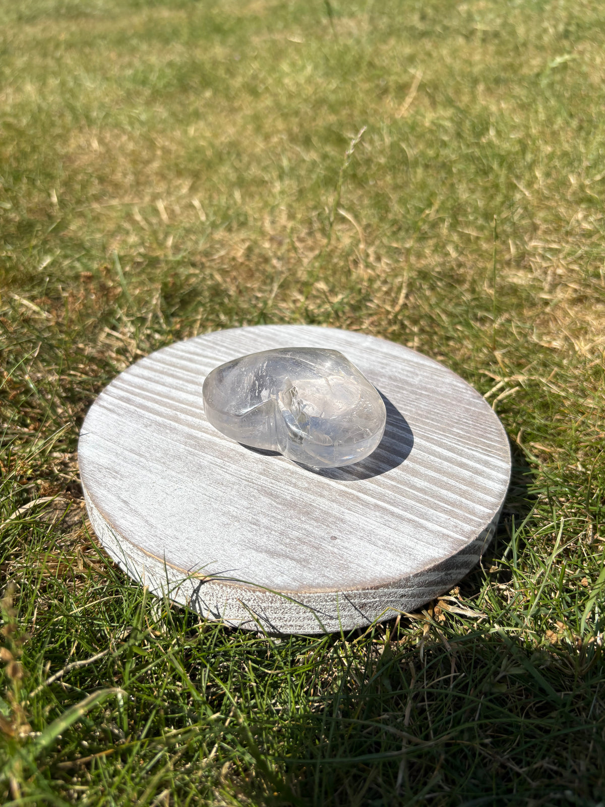 Clear quartz palmstone heart