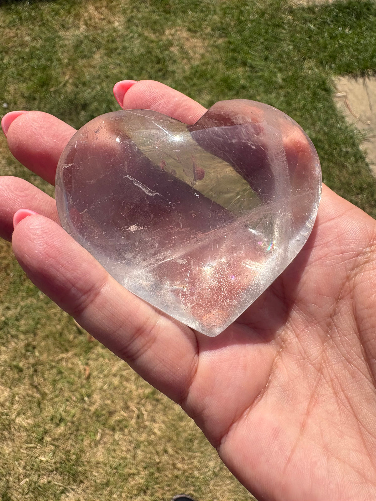 Clear quartz palmstone heart